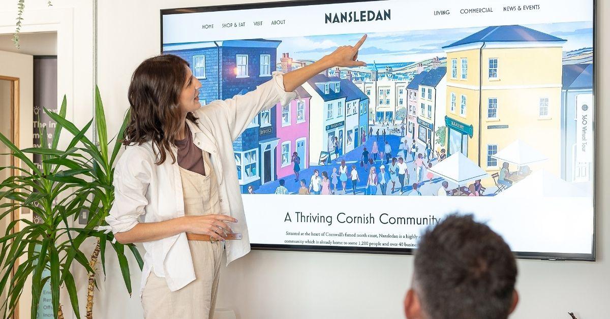 Accessibility in UX Design: What is it & Why is it Important? 1 Accessibility in UX - A designer pointing at the font on a website homepage