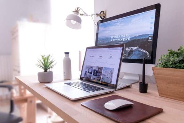 16 Simple Tips to Write a Blog Post That Ranks on Google 2 A computer and a laptop on a desk