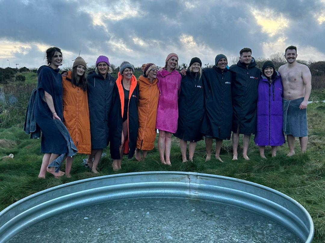 Merry Christmas From Team Solve! 1 Solve team in dry robes and towls after icebath