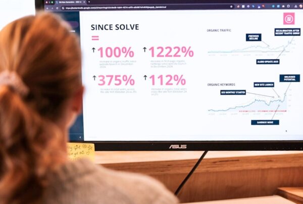 SEO vs PPC Marketing: Pros and Cons 4 A girl sat on her computer looking at amazing results achieved through SEO and PPC marketing.