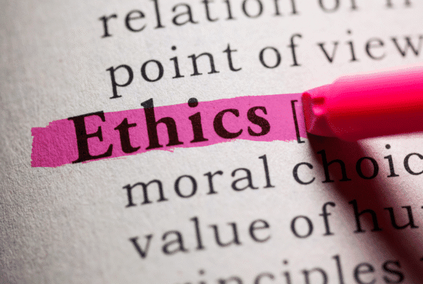Ethics being highlighted in a dictionary to resemble ethics in digital marketing